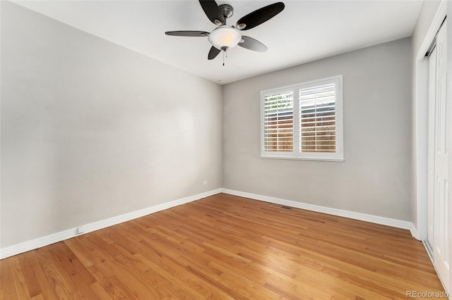 unfurnished bedroom with ceiling fan, a closet, and light hardwood / wood-style flooring