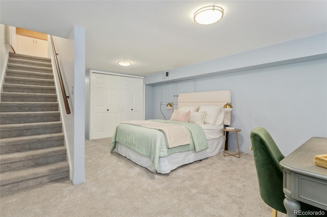 carpeted bedroom with a closet