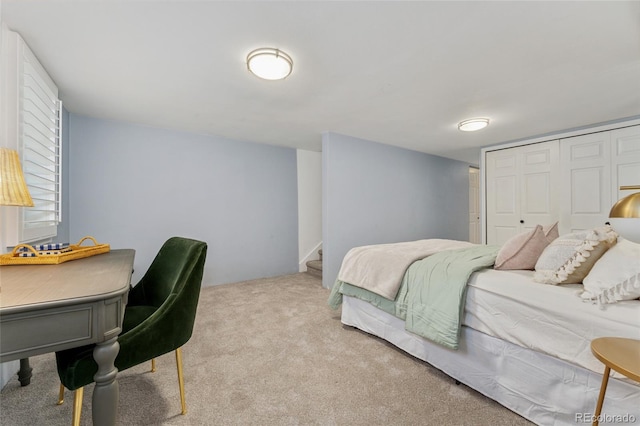 carpeted bedroom featuring a closet