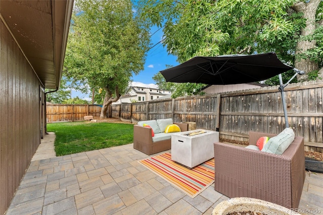 view of patio / terrace featuring an outdoor living space with a fire pit