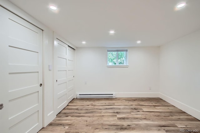 1519 16th St, Boulder, CO 80302 - unfurnished bedroom featuring baseboard heating, recessed lighting, light wood finished floors, and baseboards