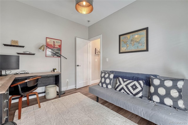 office area featuring baseboards and wood finished floors