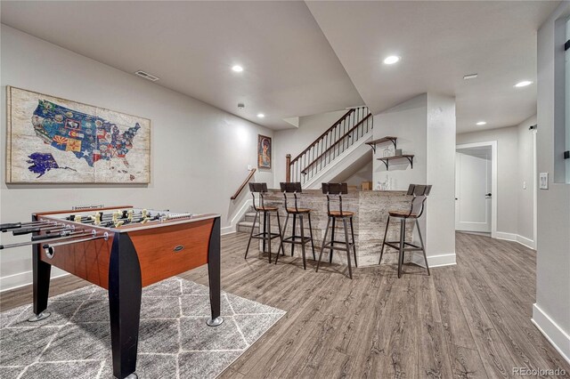 playroom featuring recessed lighting, baseboards, visible vents, and wood finished floors