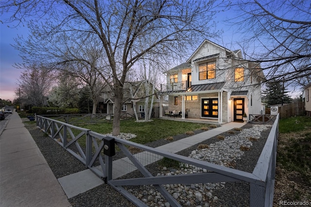 2948 S Clarkson St, Englewood, CO 80113 - modern home featuring a standing seam roof, metal roof, and a gate
