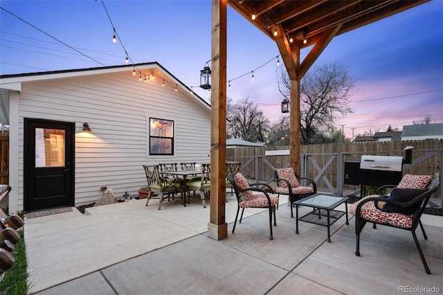 2948 S Clarkson St, Englewood, CO 80113 - view of patio featuring a fenced backyard, outdoor dining area, and a grill