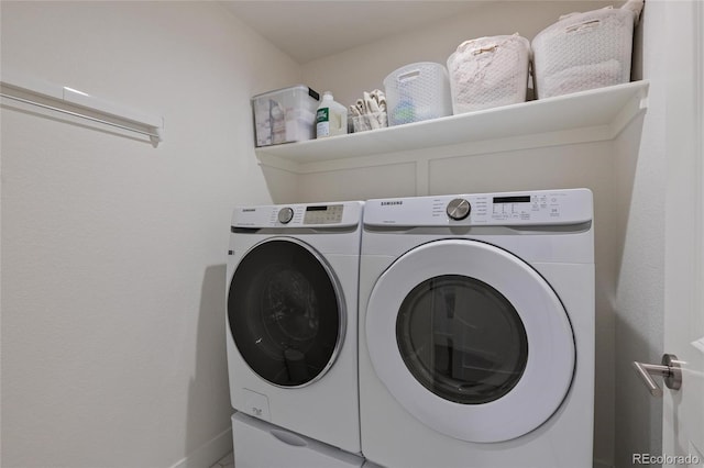 clothes washing area featuring separate washer and dryer