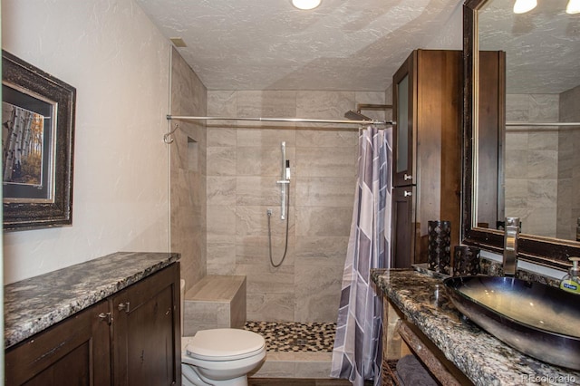 bathroom with toilet, vanity, and a shower with shower curtain