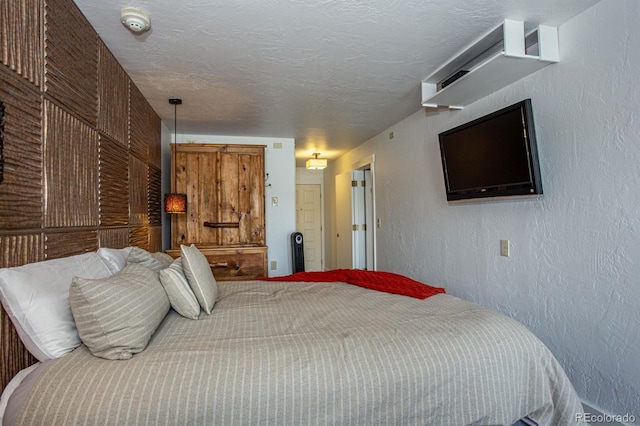 bedroom featuring a textured ceiling