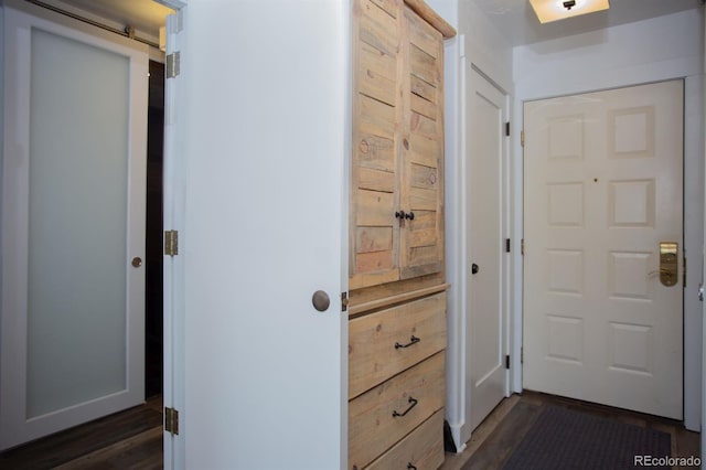 doorway to outside with dark hardwood / wood-style flooring