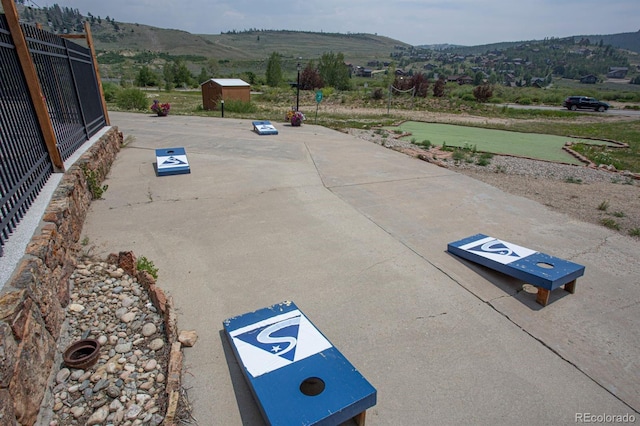 view of vehicle parking with a mountain view