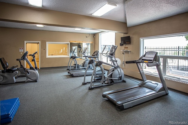 gym featuring a textured ceiling