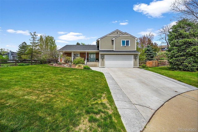10743 W Turtle Mtn, Littleton, CO 80127 - view of front of property featuring a garage, driveway, and covered porch