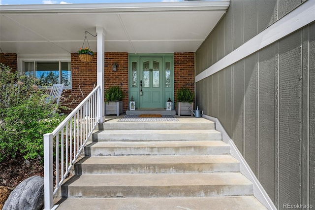 10743 W Turtle Mtn, Littleton, CO 80127 - property entrance with a porch and brick siding