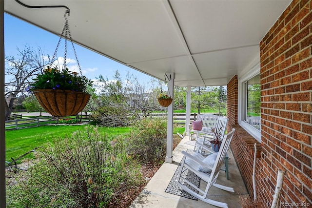 10743 W Turtle Mtn, Littleton, CO 80127 - view of patio / terrace featuring a porch and fence