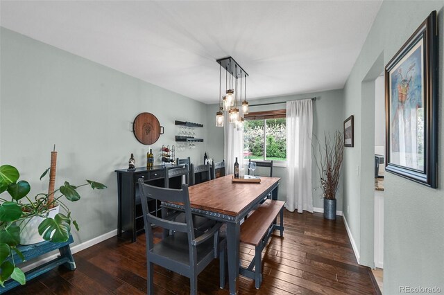 10743 W Turtle Mtn, Littleton, CO 80127 - dining room featuring hardwood / wood-style flooring, baseboards, and a chandelier