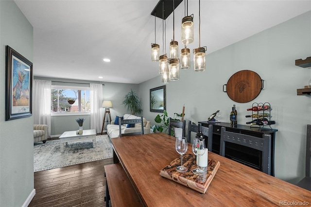 10743 W Turtle Mtn, Littleton, CO 80127 - dining area with baseboards, dark wood finished floors, and recessed lighting
