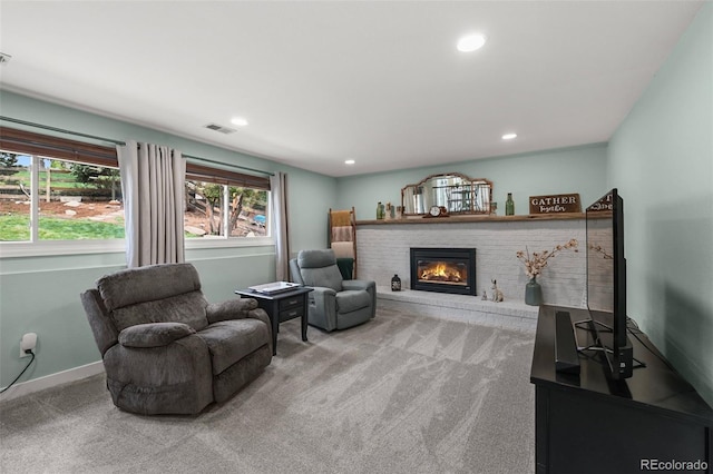 10743 W Turtle Mtn, Littleton, CO 80127 - carpeted living area featuring a brick fireplace, recessed lighting, and baseboards