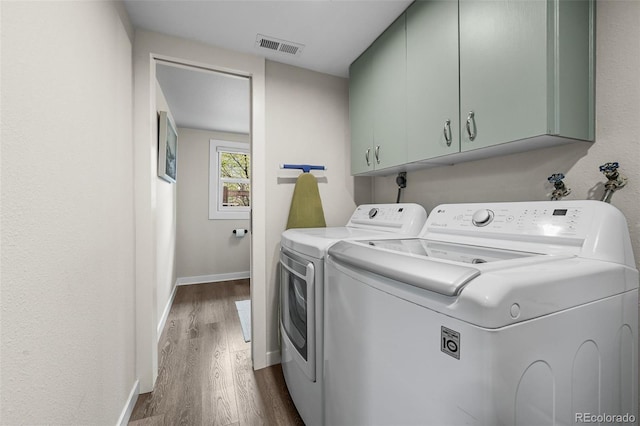 10743 W Turtle Mtn, Littleton, CO 80127 - clothes washing area featuring cabinet space, independent washer and dryer, dark wood-style flooring, and baseboards