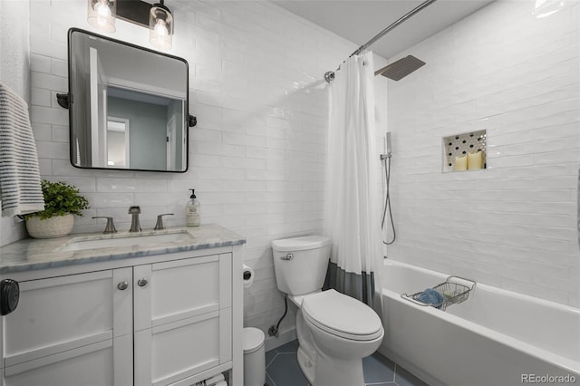 10743 W Turtle Mtn, Littleton, CO 80127 - bathroom featuring toilet, vanity, tile patterned flooring, shower / bath combo with shower curtain, and tile walls