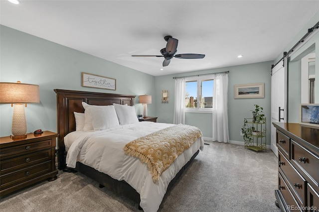 10743 W Turtle Mtn, Littleton, CO 80127 - carpeted bedroom with a barn door, recessed lighting, baseboards, and a ceiling fan