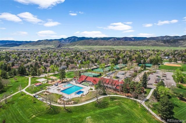 10743 W Turtle Mtn, Littleton, CO 80127 - aerial view of residential area featuring a pool area and a mountainous background