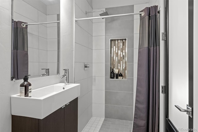2523 N Humboldt St, Denver, CO 80205 - bathroom featuring tiled shower and vanity