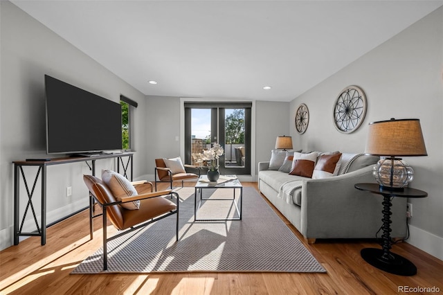 2523 N Humboldt St, Denver, CO 80205 - living area featuring wood finished floors and recessed lighting