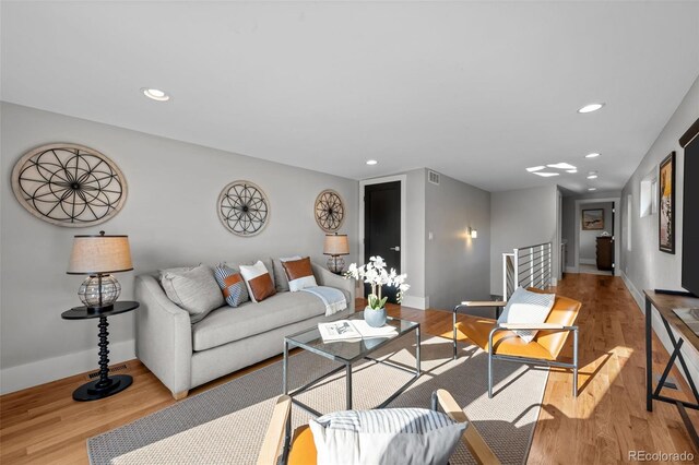 2523 N Humboldt St, Denver, CO 80205 - living room featuring recessed lighting and light wood-style flooring