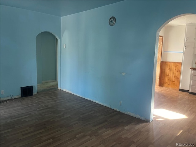 empty room featuring dark hardwood / wood-style floors