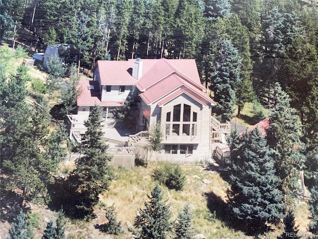 bird's eye view featuring a forest view