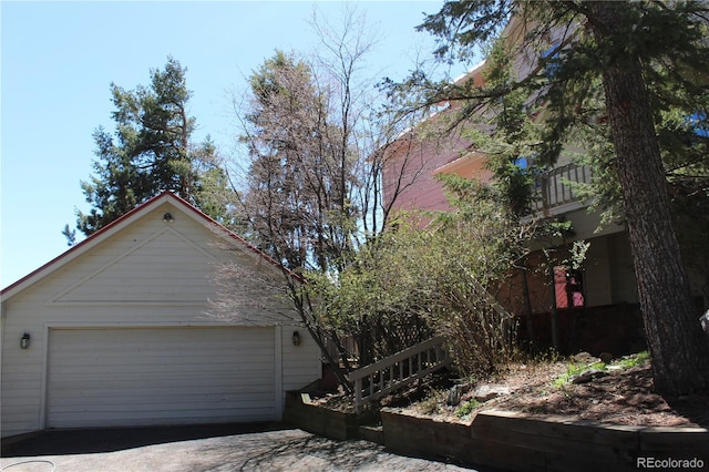 view of property exterior featuring a garage