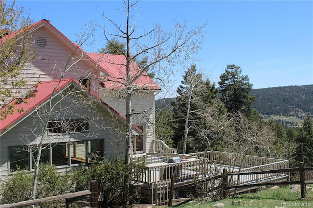 view of home's exterior featuring a deck