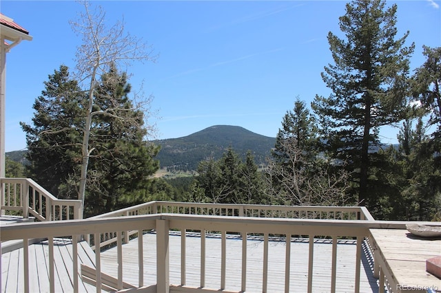 wooden deck with a mountain view