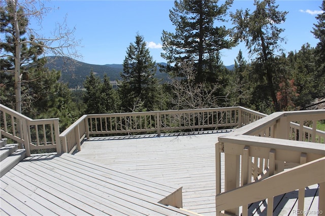 wooden deck featuring a mountain view