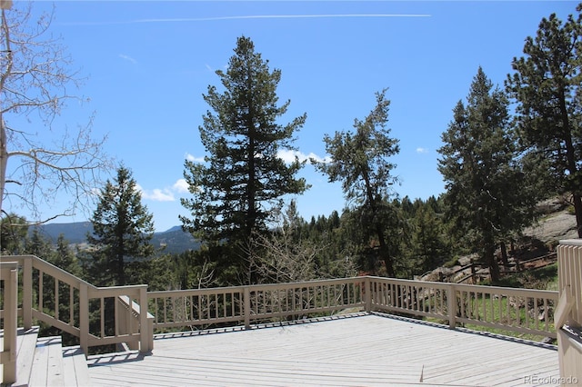 wooden deck with a mountain view