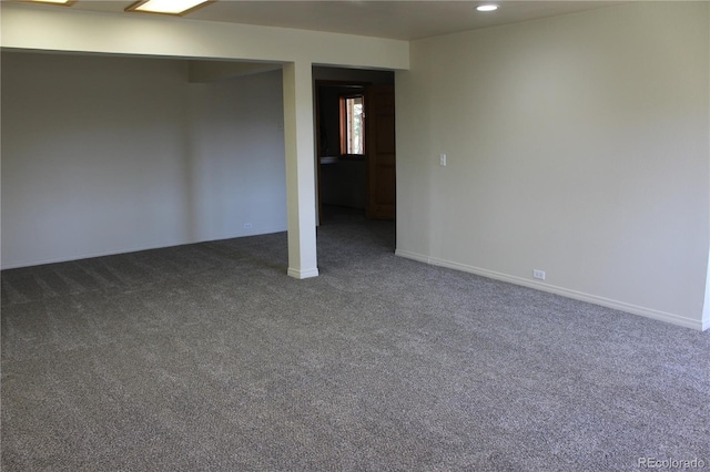 spare room featuring baseboards, carpet, and recessed lighting