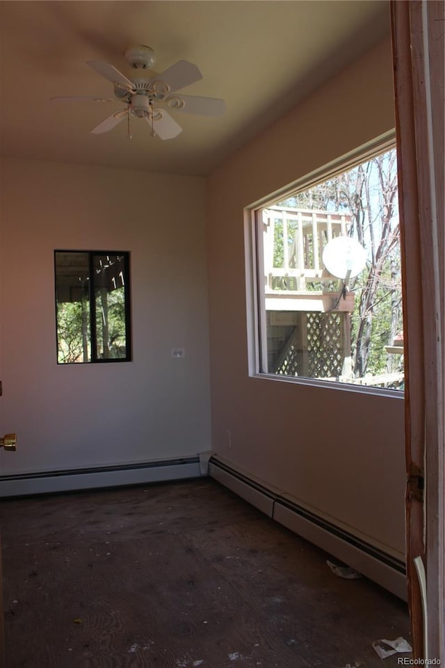 spare room with ceiling fan and baseboard heating