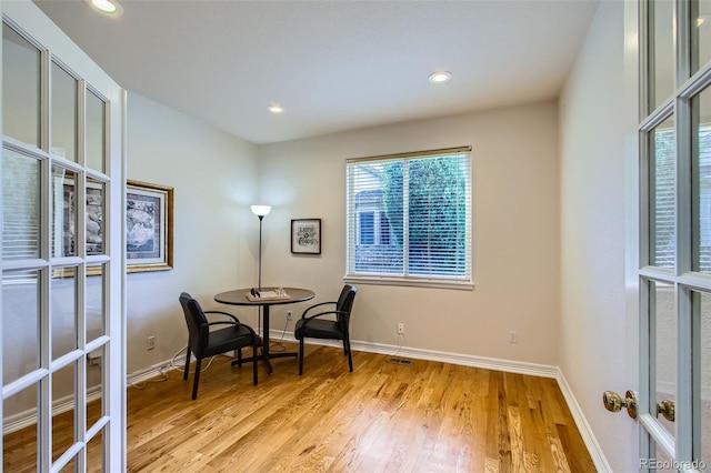 7482 Routt Ln, Arvada, CO 80005 - dining area with french doors, light wood-style floors, and recessed lighting