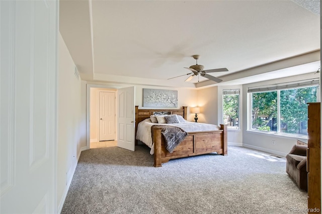 7482 Routt Ln, Arvada, CO 80005 - bedroom featuring carpet floors, ceiling fan, and a tray ceiling