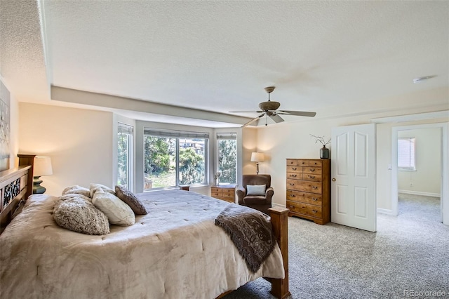 7482 Routt Ln, Arvada, CO 80005 - carpeted bedroom featuring a textured ceiling and ceiling fan
