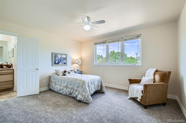 7482 Routt Ln, Arvada, CO 80005 - bedroom featuring light colored carpet, a ceiling fan, and connected bathroom