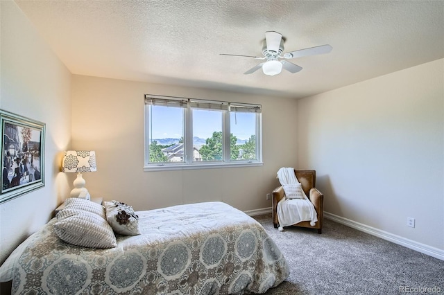 7482 Routt Ln, Arvada, CO 80005 - bedroom with carpet floors, a textured ceiling, and a ceiling fan