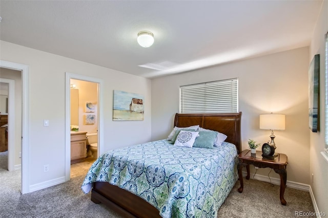 7482 Routt Ln, Arvada, CO 80005 - carpeted bedroom featuring baseboards and connected bathroom