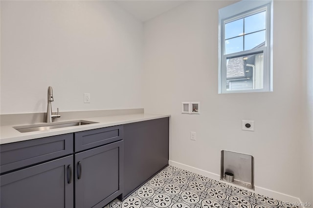 laundry room with sink, cabinets, hookup for an electric dryer, hookup for a washing machine, and light tile patterned flooring