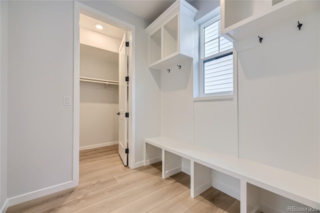 mudroom with light hardwood / wood-style floors