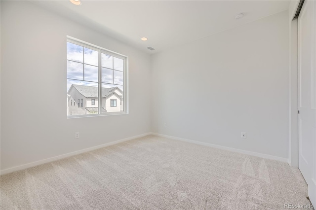 unfurnished room with carpet floors