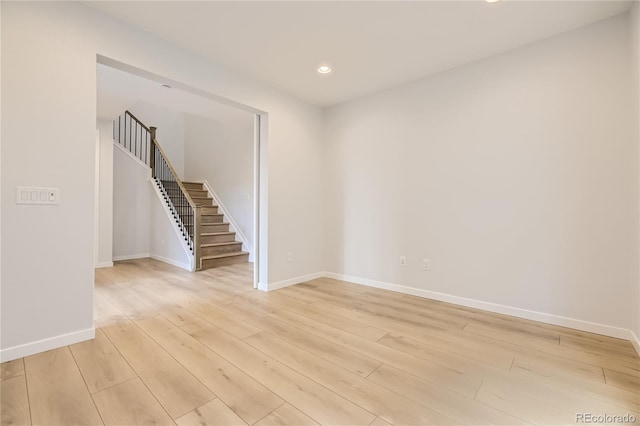 spare room with light wood-type flooring