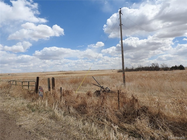 view of yard with a rural view