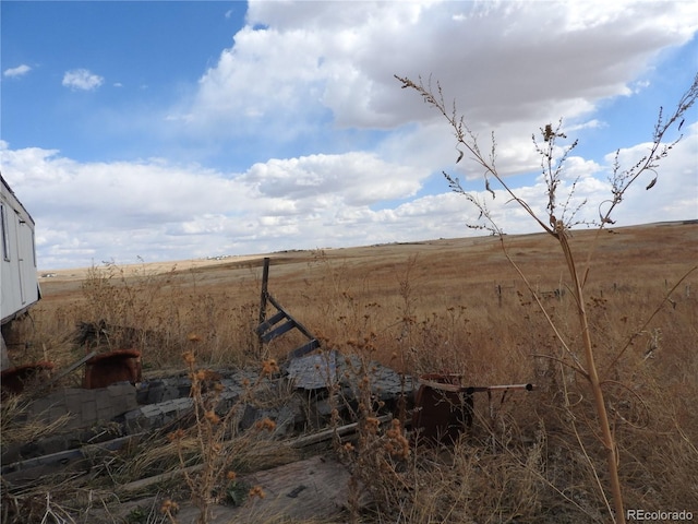 view of yard with a rural view