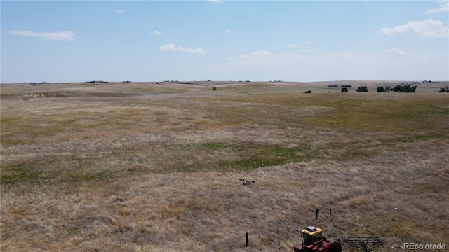 view of yard with a rural view